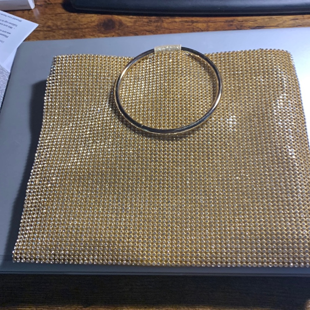 Golden clutch purse for an elegant night out or wedding party.